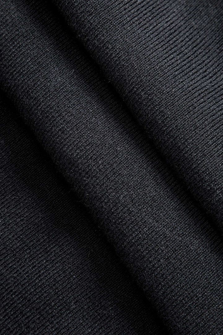 Asymetrická sukně s knoflíky z pevné látky