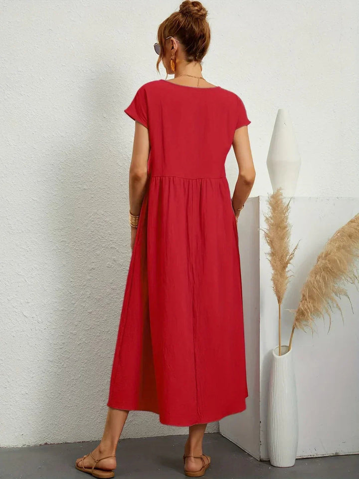 Adéla – Volné midi šaty s kapsami pro každodenní eleganci