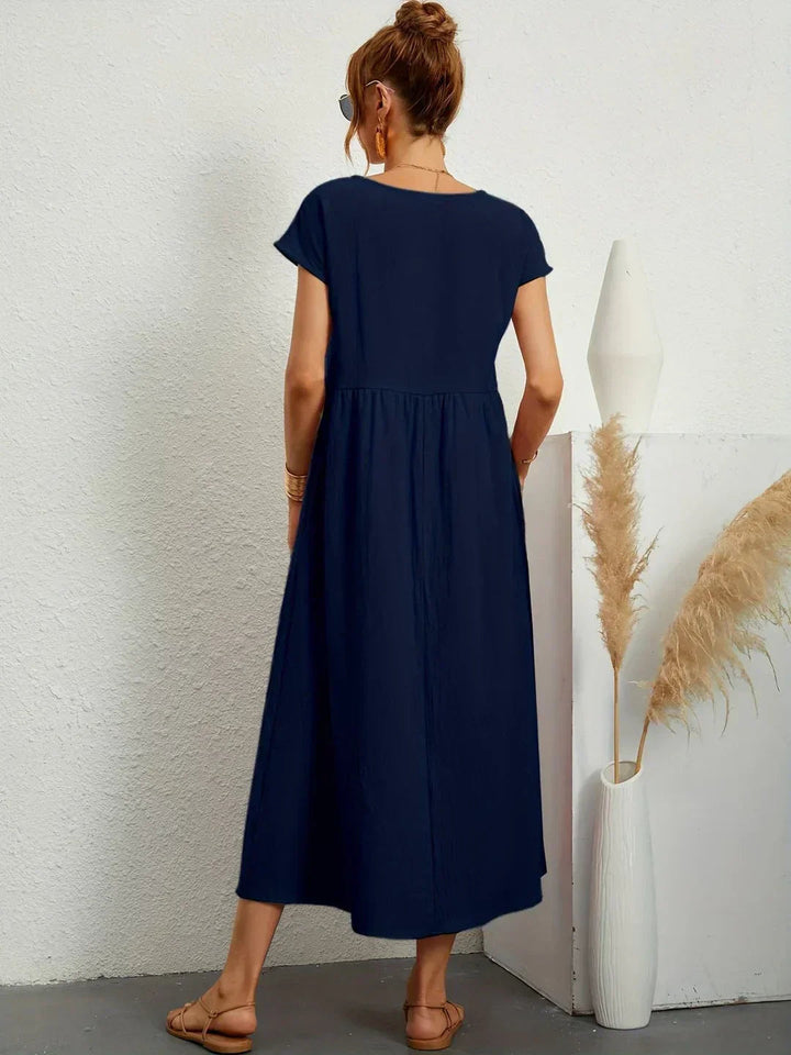 Adéla – Volné midi šaty s kapsami pro každodenní eleganci