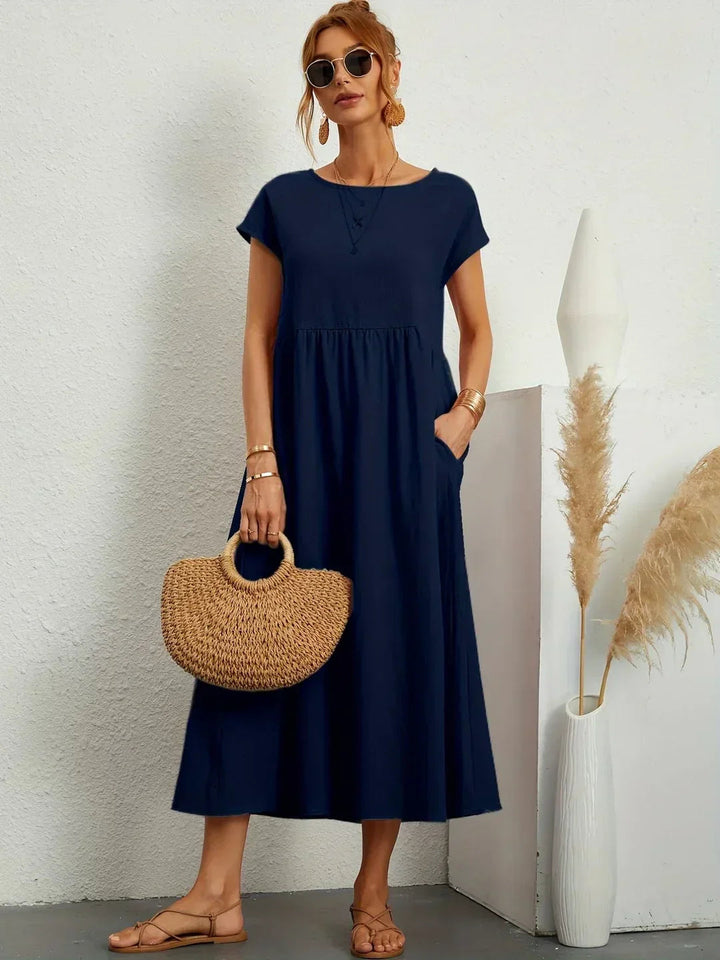 Adéla – Volné midi šaty s kapsami pro každodenní eleganci