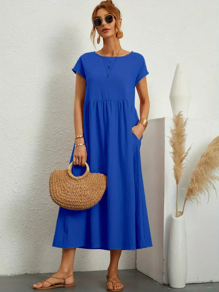 Adéla – Volné midi šaty s kapsami pro každodenní eleganci