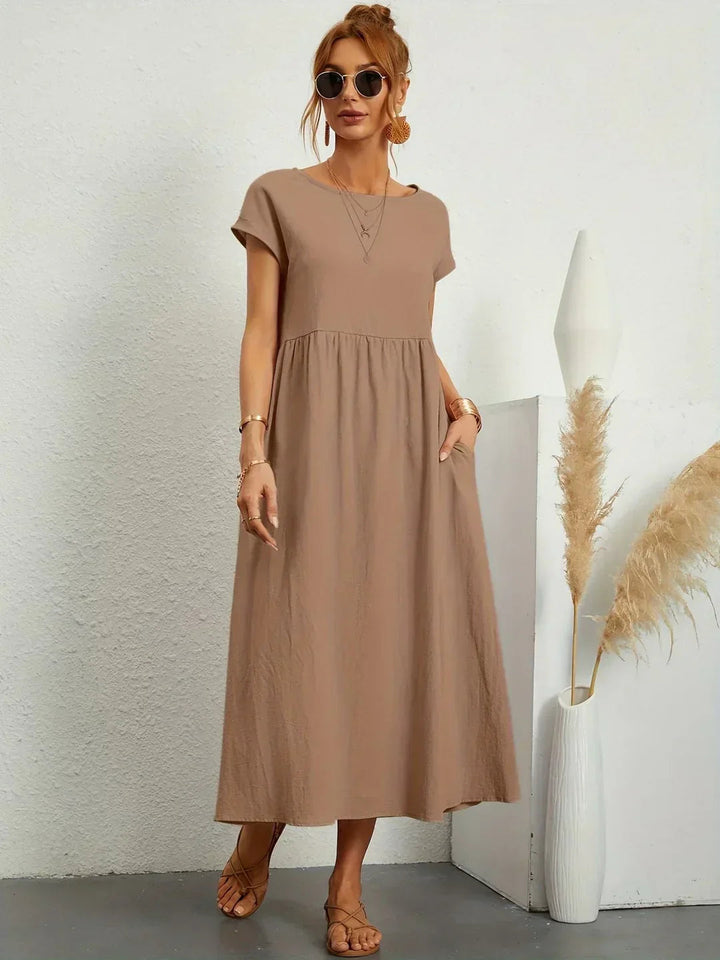 Adéla – Volné midi šaty s kapsami pro každodenní eleganci