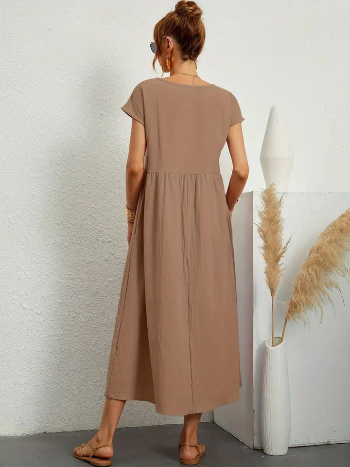 Adéla – Volné midi šaty s kapsami pro každodenní eleganci