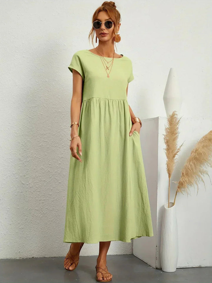 Adéla – Volné midi šaty s kapsami pro každodenní eleganci