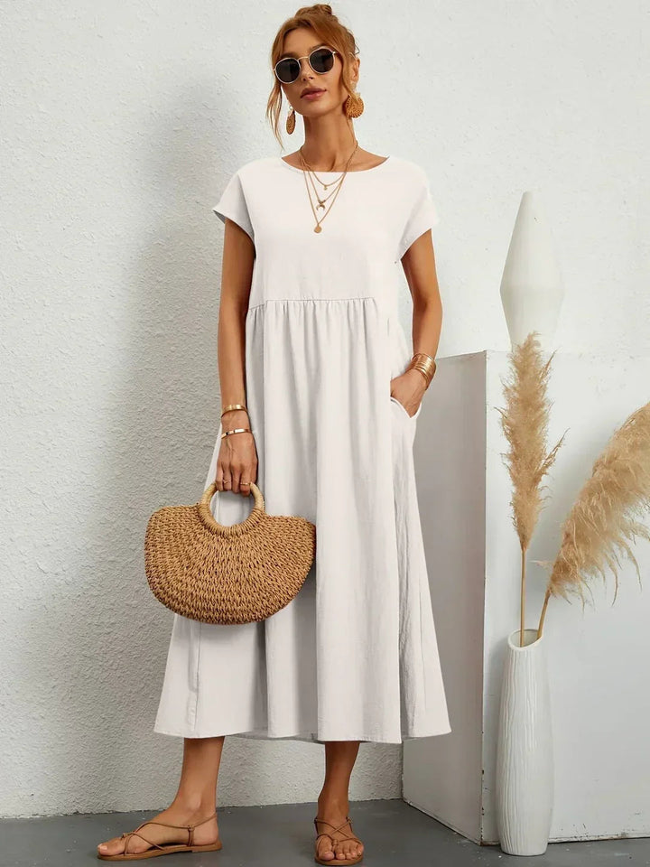 Adéla – Volné midi šaty s kapsami pro každodenní eleganci