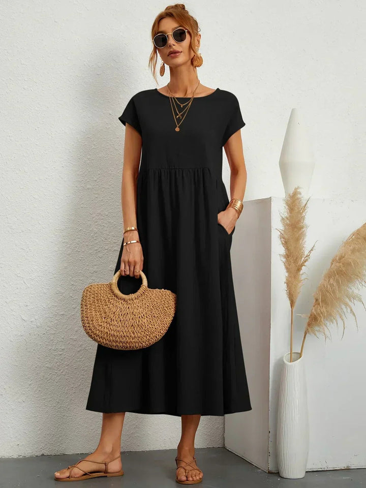 Adéla – Volné midi šaty s kapsami pro každodenní eleganci